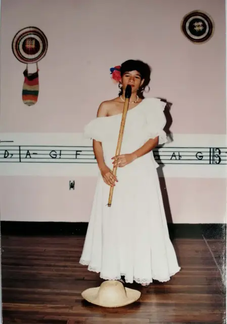 A young Mayte Montero with her gaita on stage.